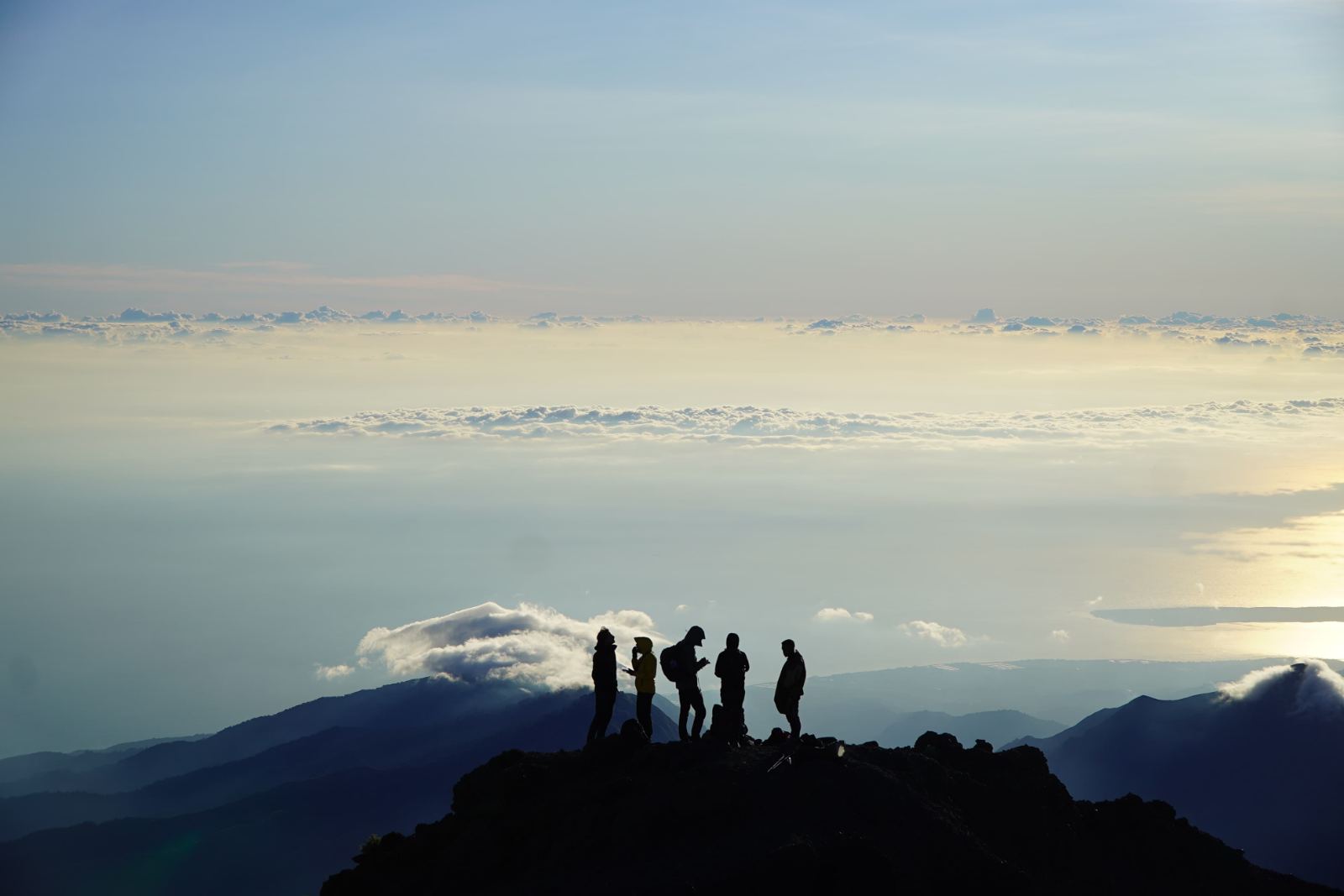 First light on the summit ridge above the clouds