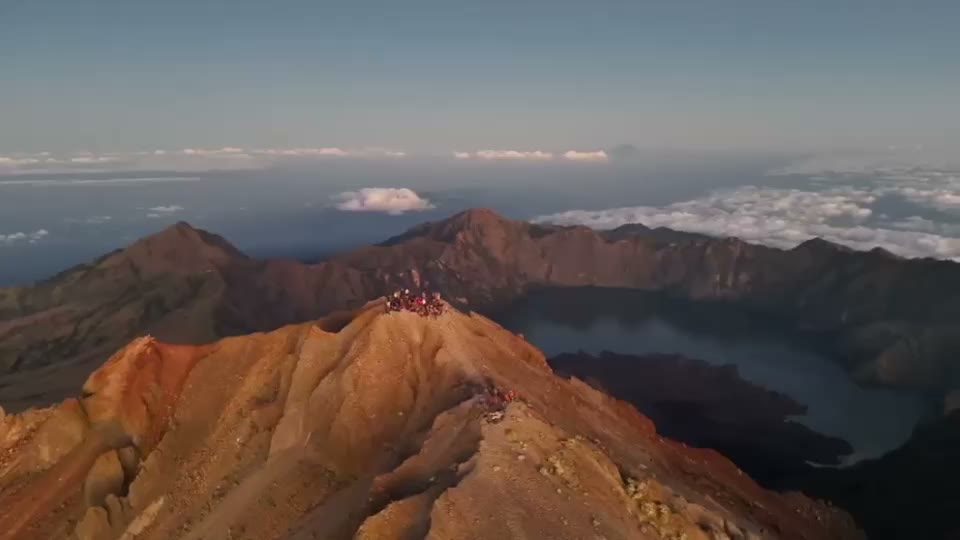 Segara Anak crater lake seen from the rim, the summit cone behind