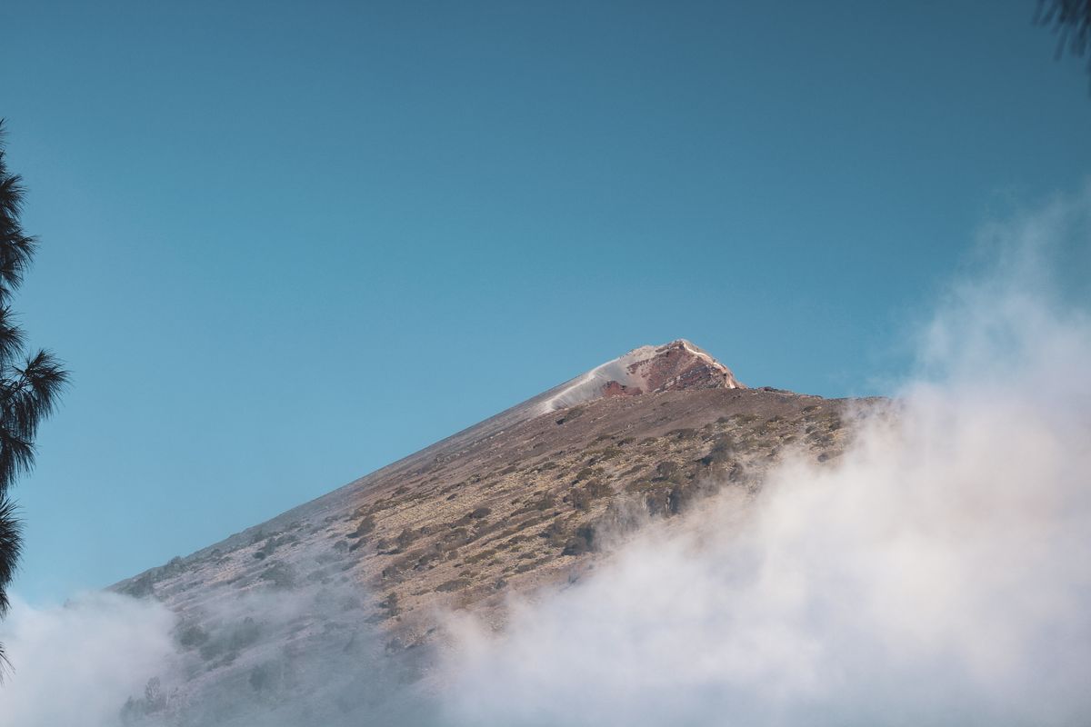Rinjani's peak above a sea of clouds, from the crater rim
